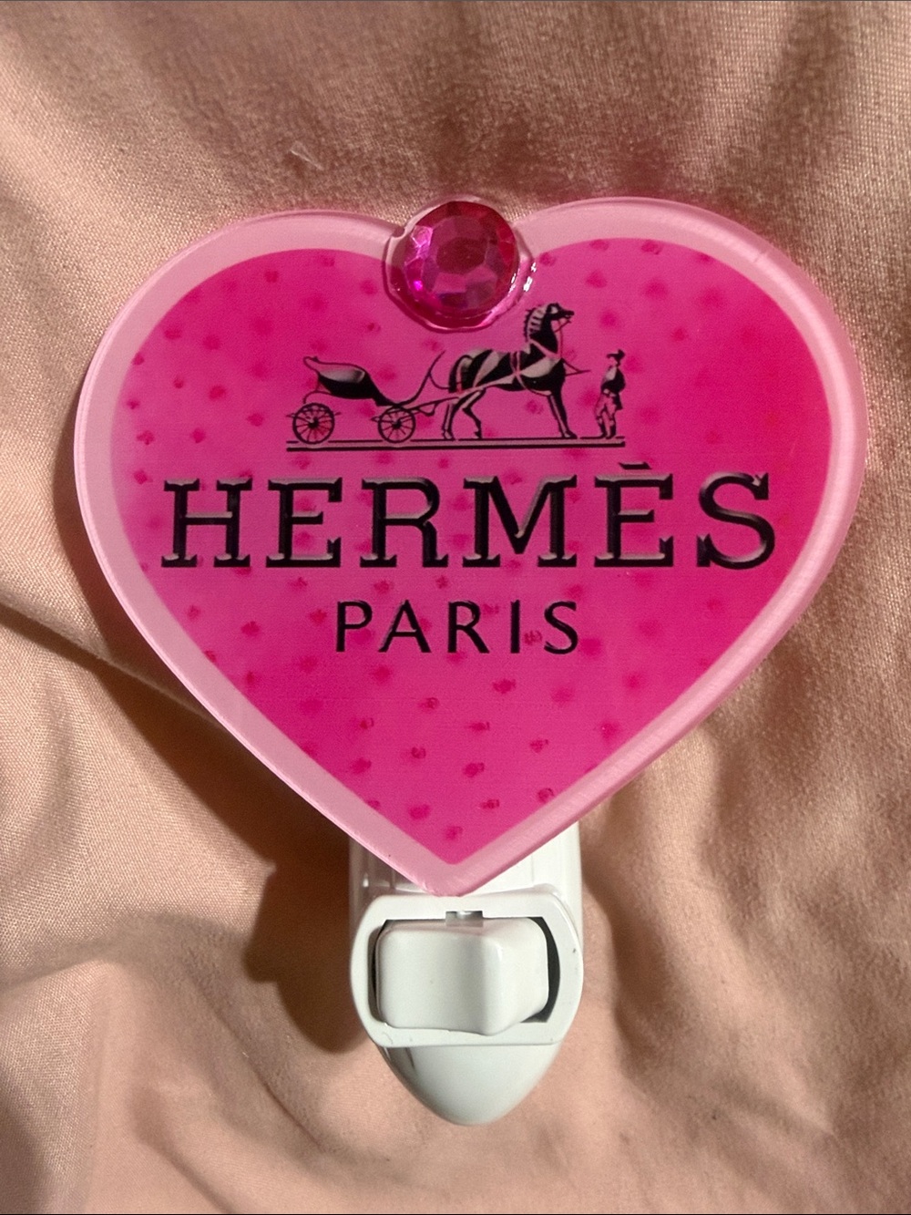 Pink heart plug in night light.  Does not include bulb.